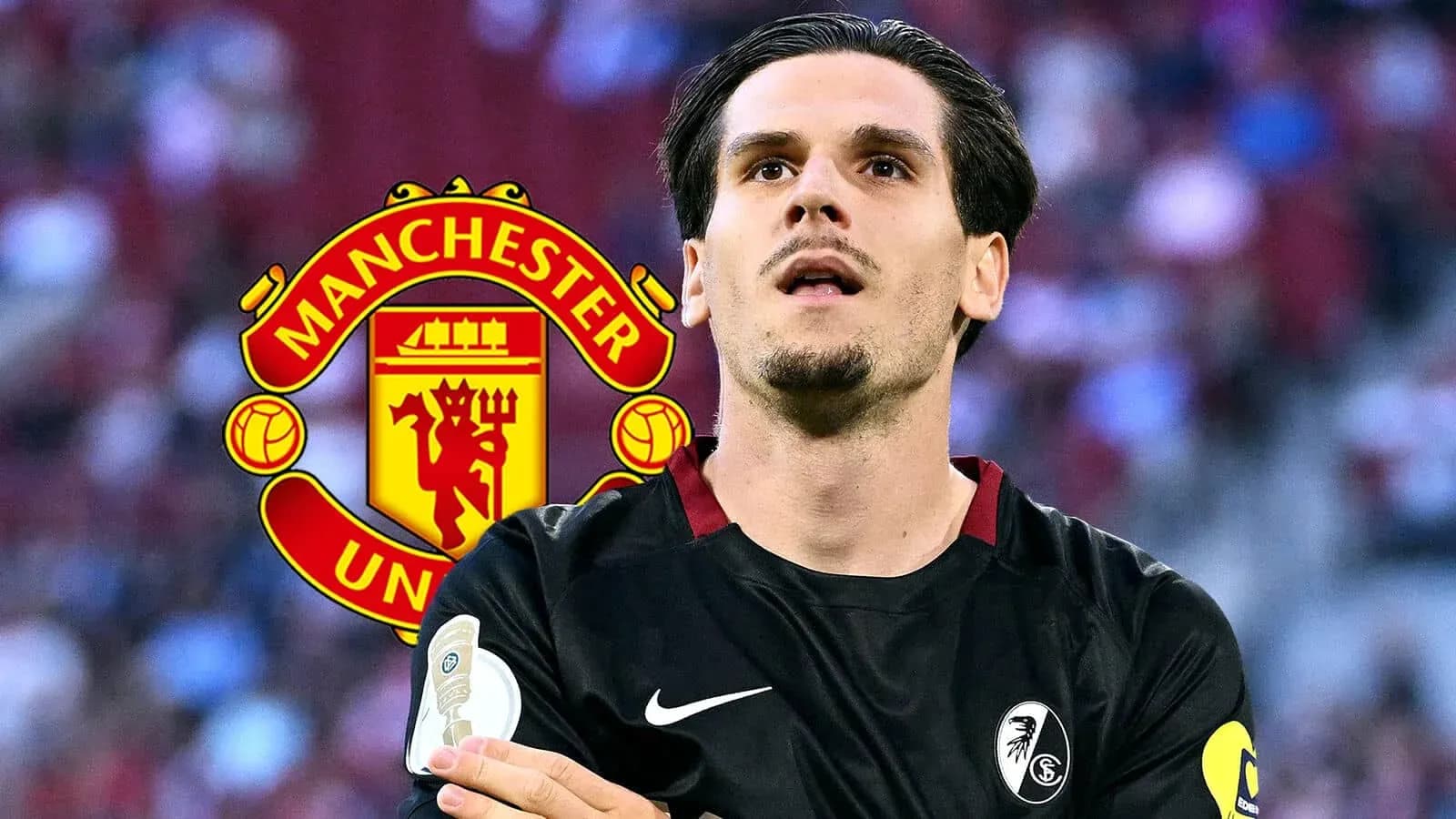 Jugador con camiseta negra frente al logo de Manchester United