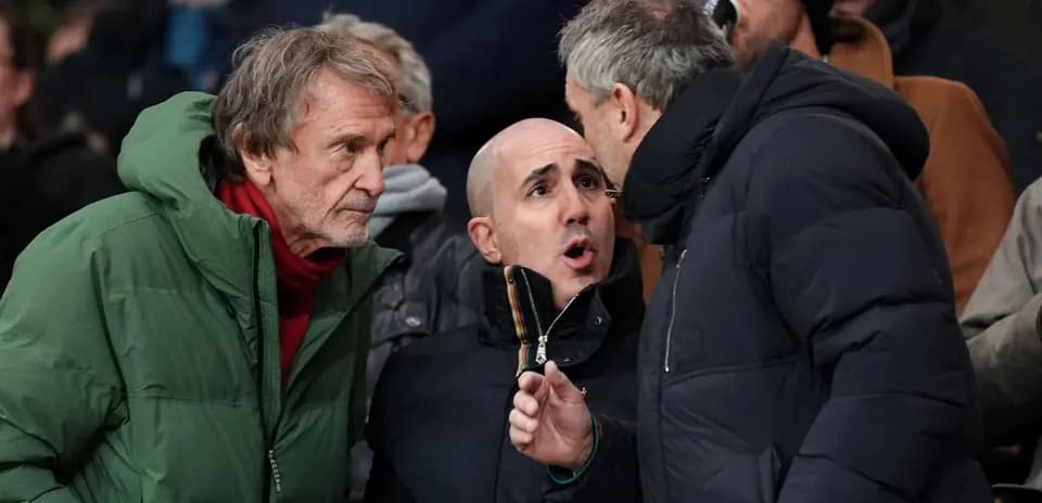 A group of fans discussing during a match