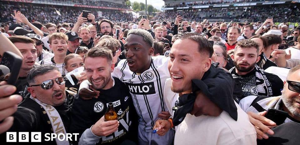 Celebration among fans and players in stadium