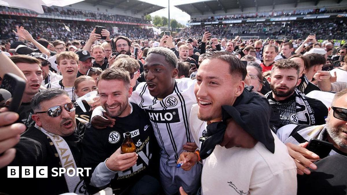 Celebration among fans and players in stadium