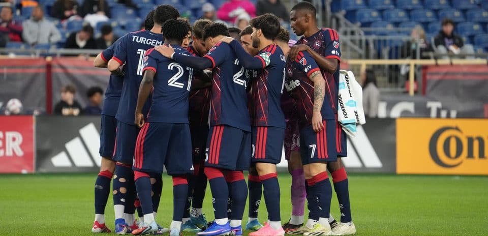 Jugadores de New England II en círculo