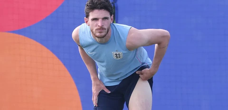 Jugador de Inglaterra estirándose durante entrenamiento