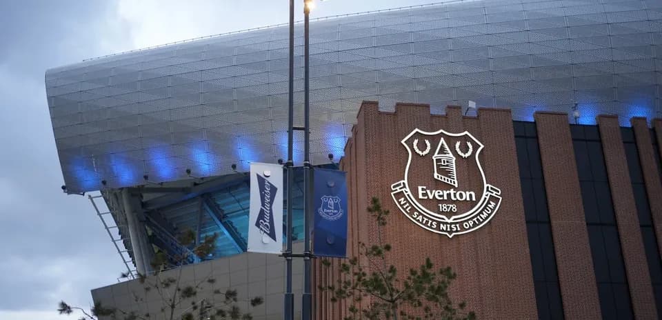 Exterior of Everton stadium with club logo displayed