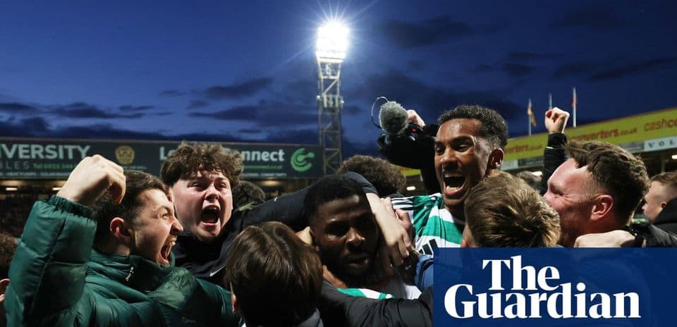 Agroup of fans celebrating a victory at the stadium