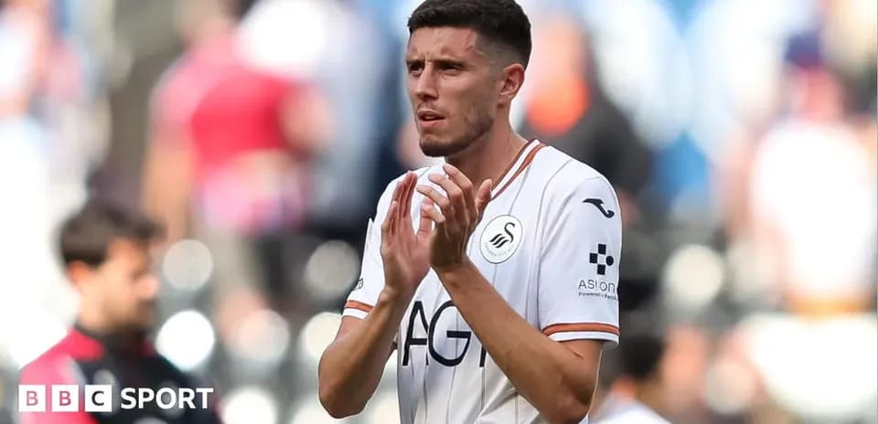 Jugador de Swansea City aplaudiendo en el campo