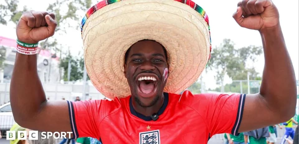 Fan celebrating in sombrero and England jersey