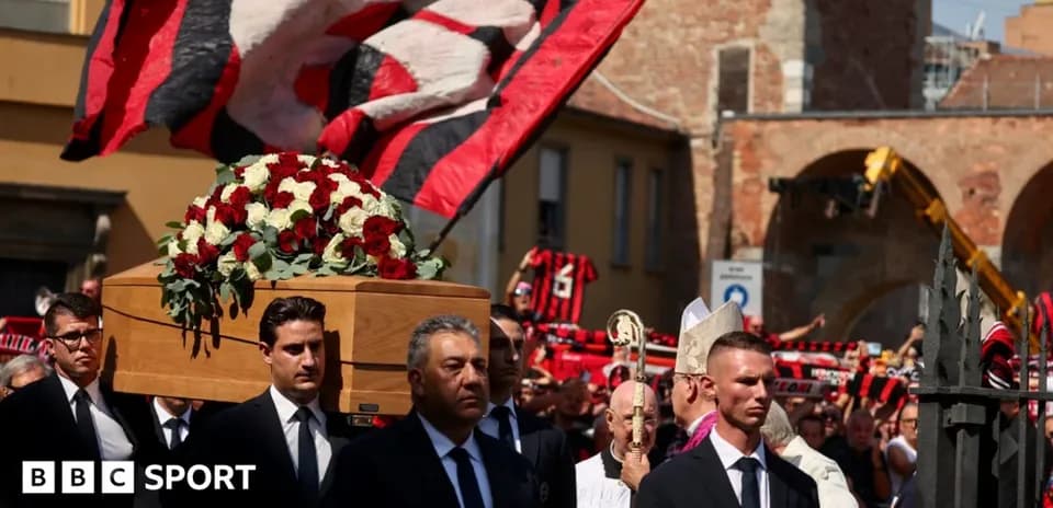 Funeral procession with coffin and flowers in crowd