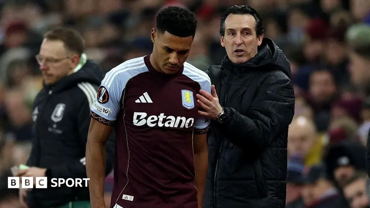 Entrenador hablando con jugador de Aston Villa durante partido