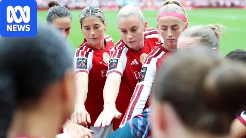 Jugadoras de fútbol en círculo antes del partido