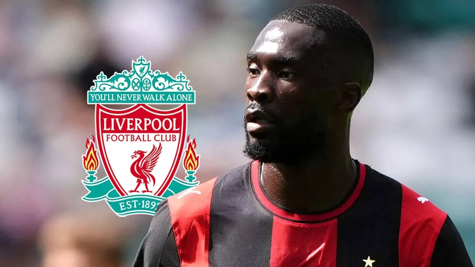 Jugador con camiseta negra y roja, logo de Liverpool Jugador con camiseta negra y roja, logo de Liverpool